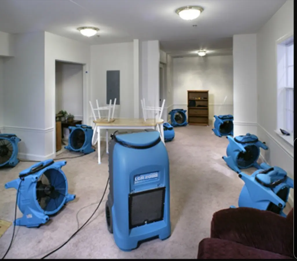 Air movers and dehumidifier setup for Water Damage Restoration in Orange